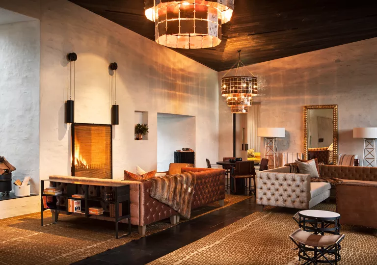 living room with big chandelier and fire place