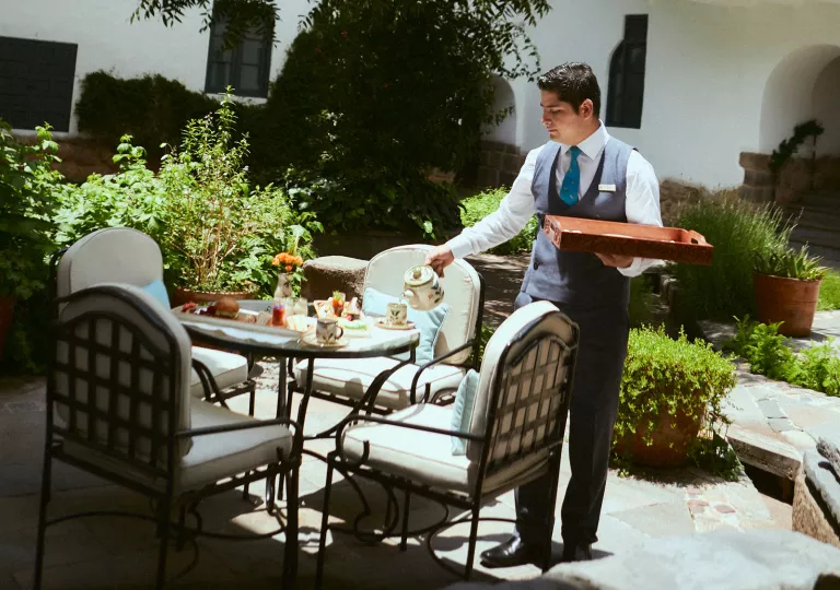 waiter setting table outside