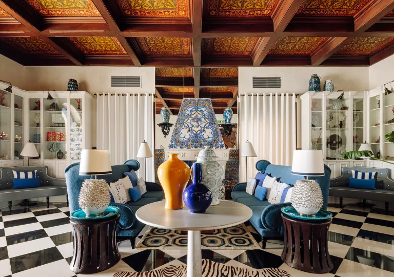 colorful sitting room with blue couches