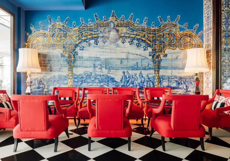 red chairs in a room with blue tile backsplash