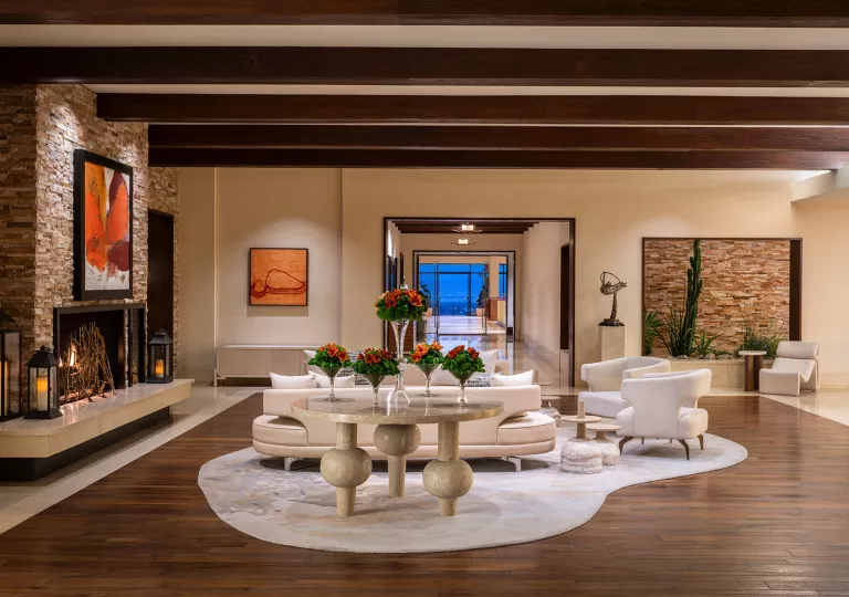 Indoor lobby with a white couch over a white rug