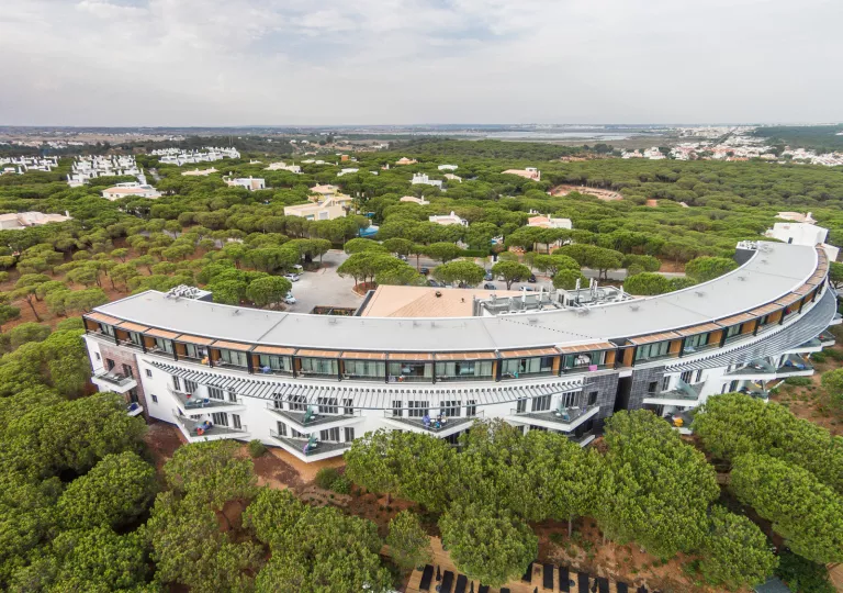 Crescent-shaped building with multiple balconies