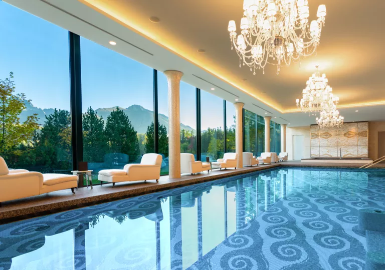 pool with chandeliers and view of mountains