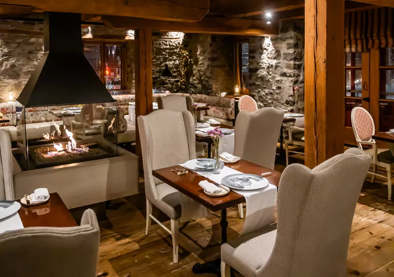 dining room with fireplace in the middle