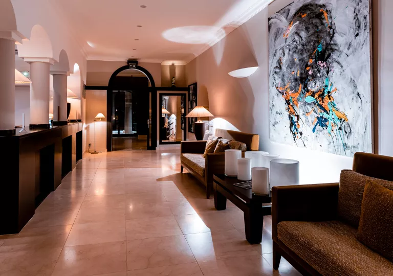 hotel lobby with desk and chairs