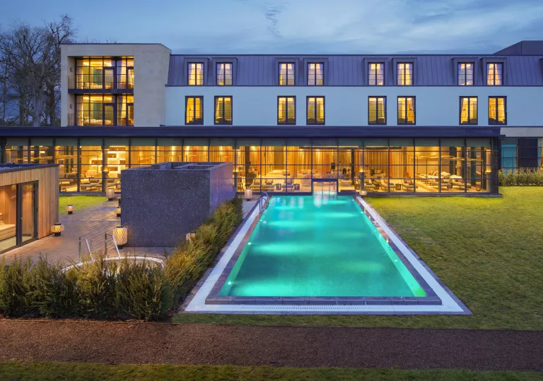 Large swimming pool outside of hotel