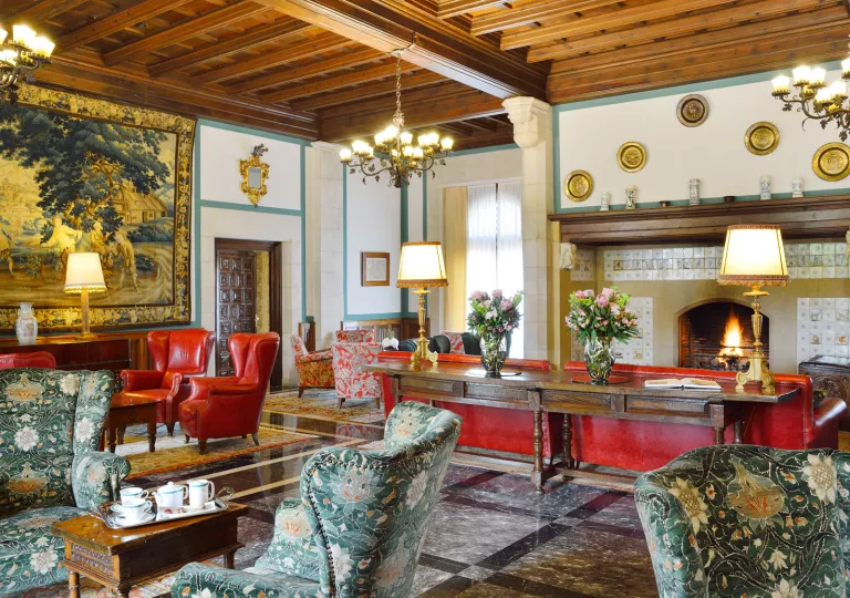 Lobby with red and white chairs and furniture and metal fixtures on the walls