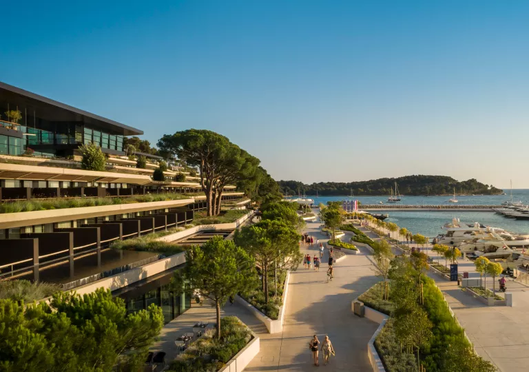 Hotel overlooking a boardwalk and water