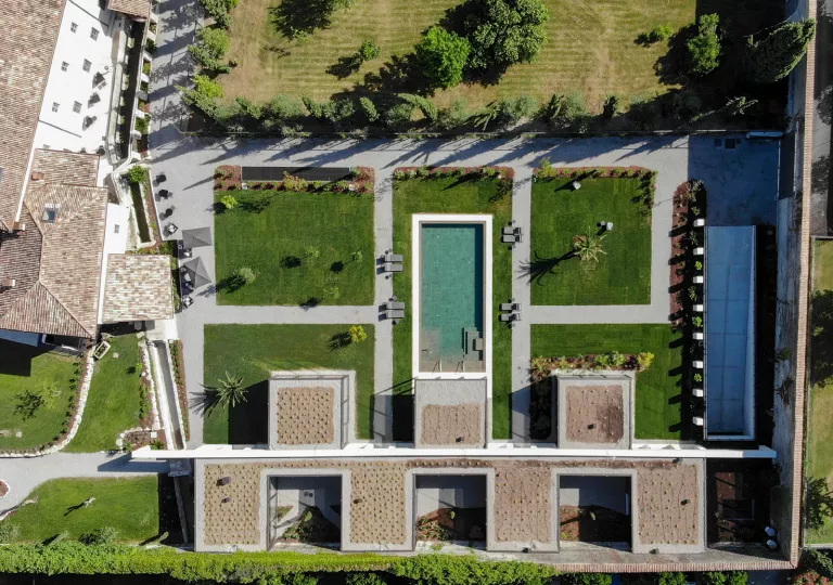Top-down view of an outdoor courtyard with a pool