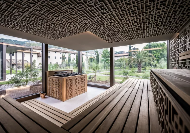 Outdoor sauna with windows looking out to a courtyard