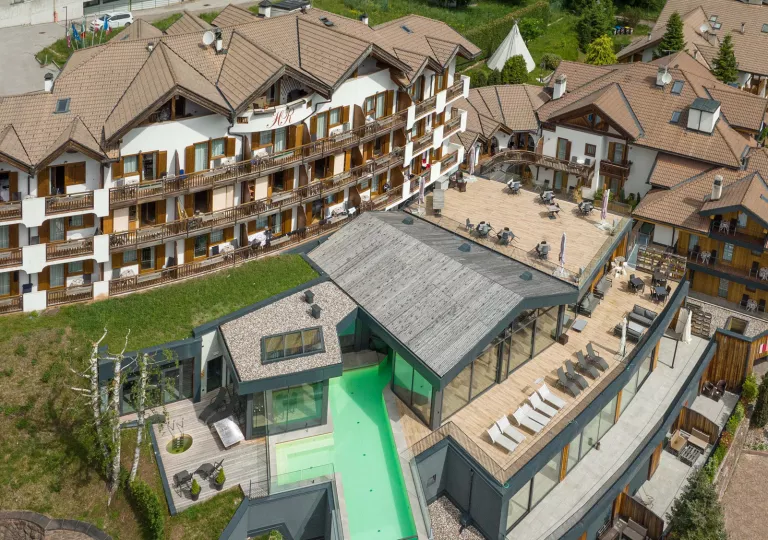 Top view of a hotel room with balconies and lawn chairs
