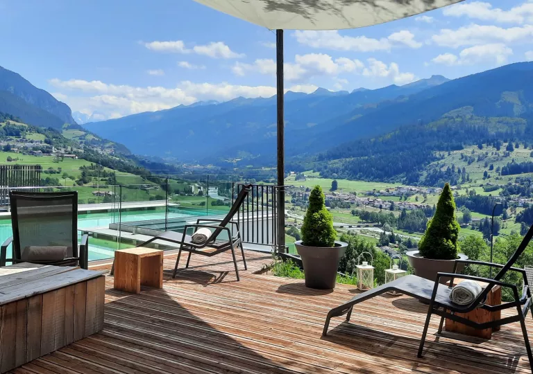 Outdoor, rooftop pool with pool chairs surrounding