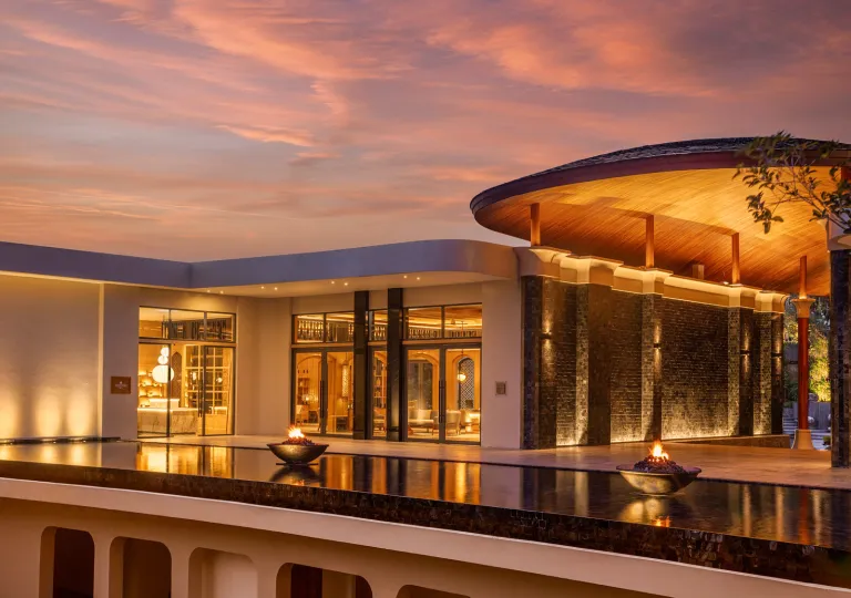 resort lit up at sunset