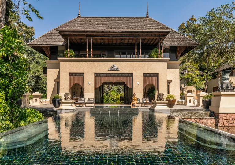 building with balcony looking over pool
