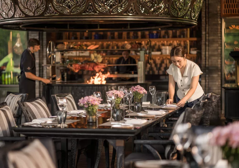 wait staff setting the table