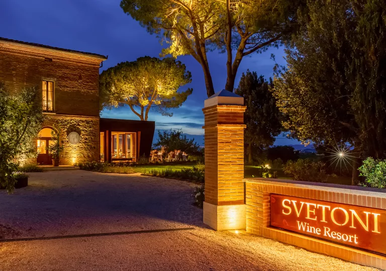 Nigh time view of hotel with illuminated outdoor sign