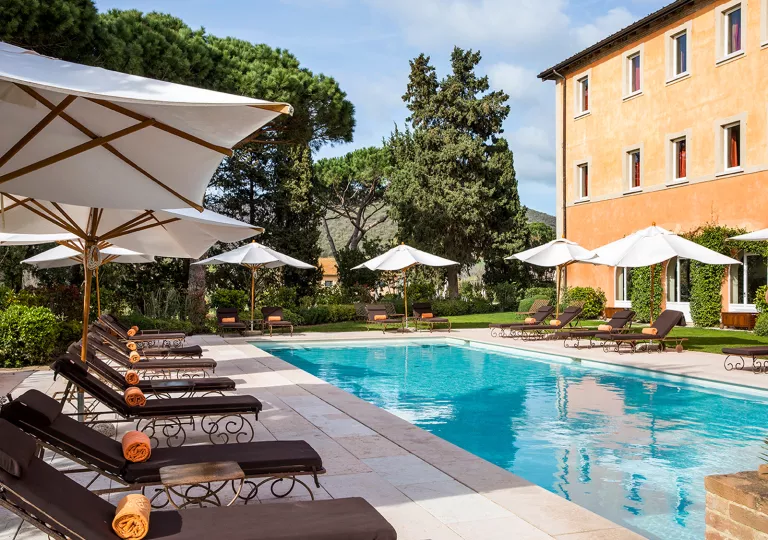 hotel pool with lounge chairs