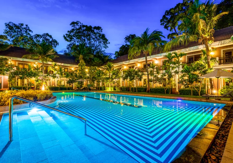 swimming pool lit up at night