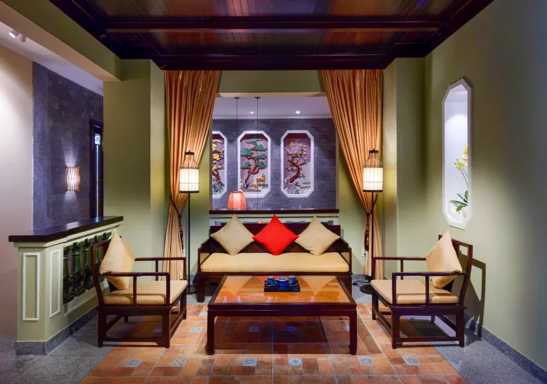 Indoor seating area, with cushioned chairs and a center coffee table