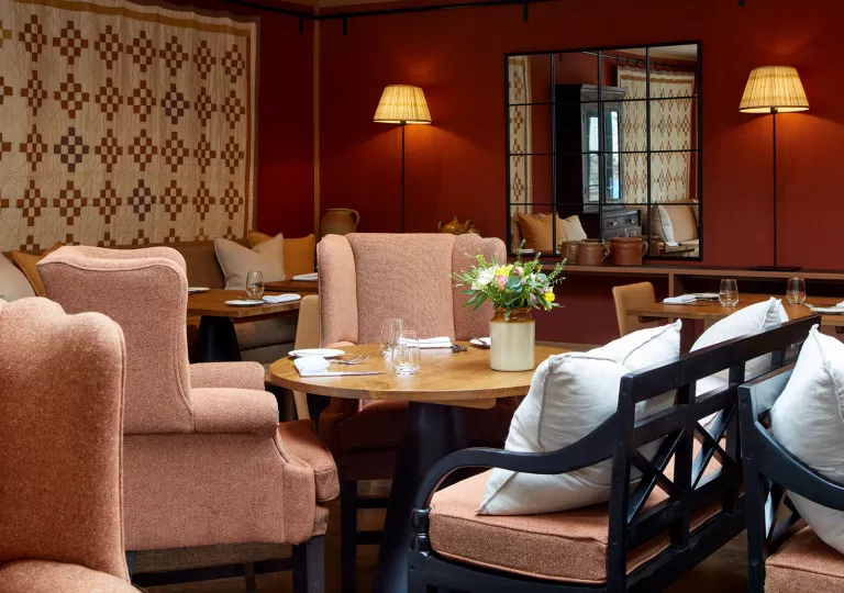 pink chairs around a table