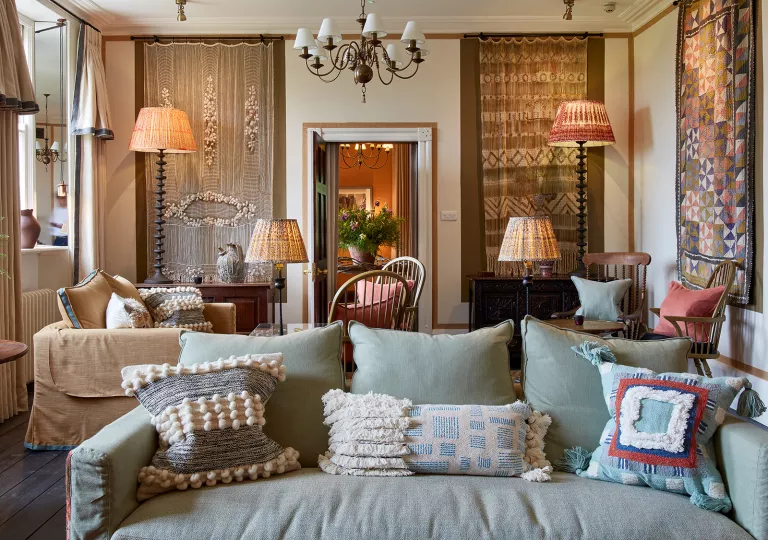 blue couch in ornate living room