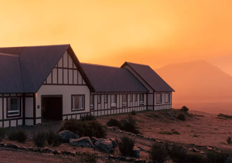 orange sunset behind hotel building