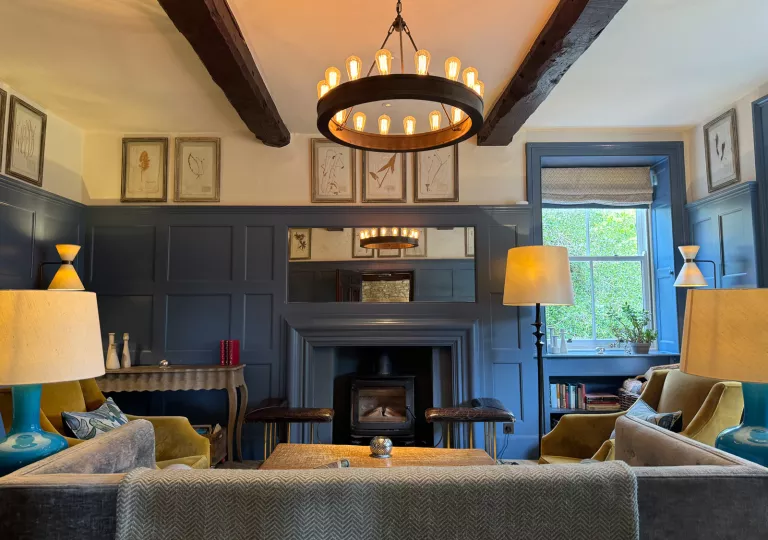 living room with fireplace and chandelier