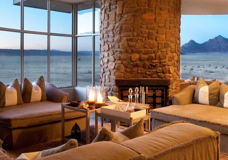 lodge with fireplace and view of water