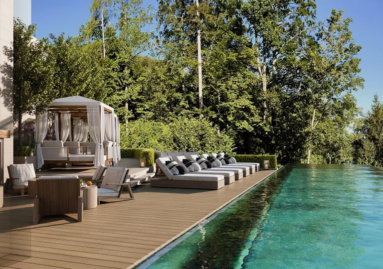 swimming pool with lounge chairs next to it