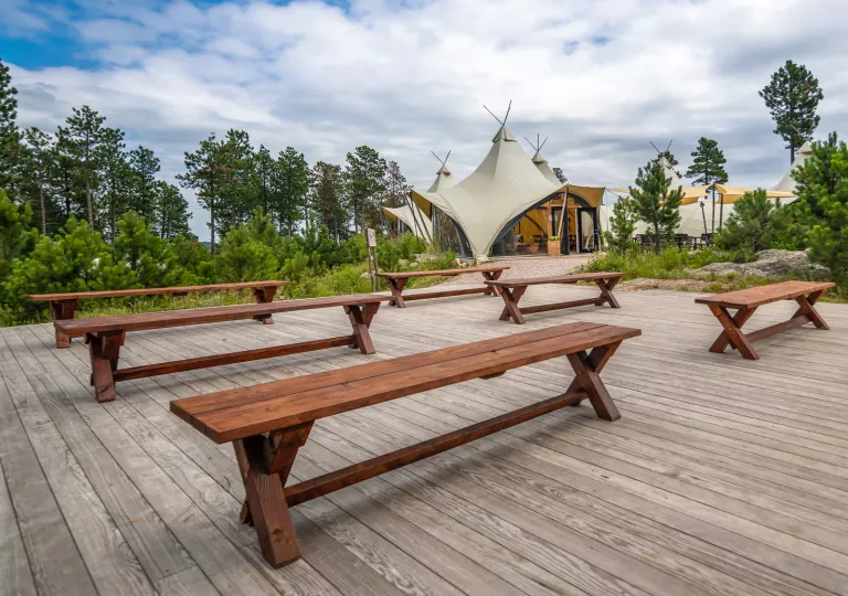 Outdoor patio with wood flooring and wooden benches