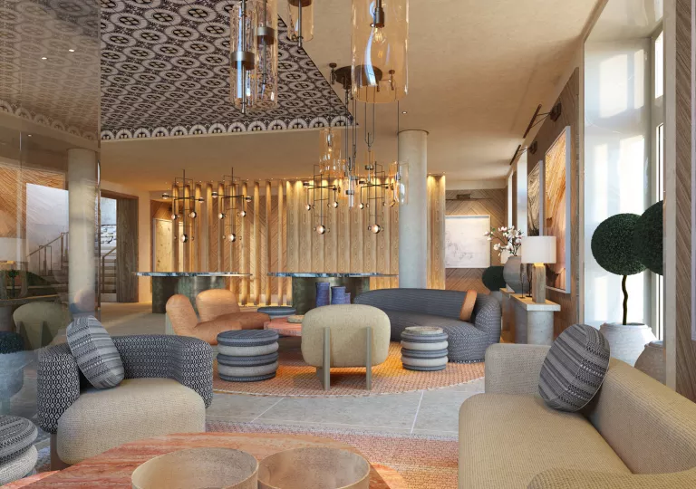 Lounge with circular, cushioned sofas and artistic light fixtures