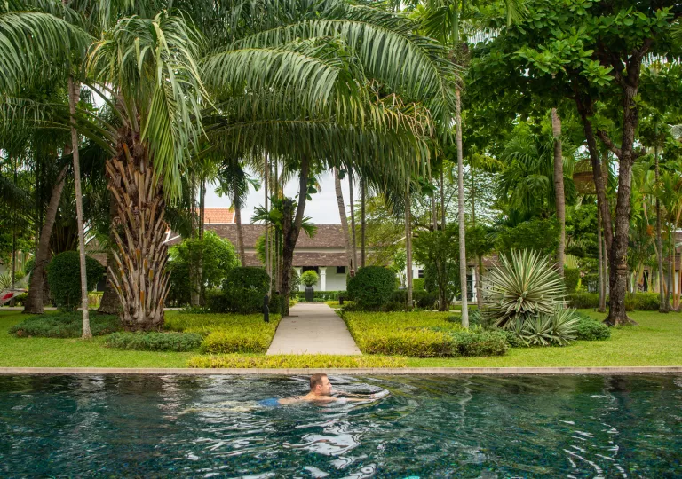 Outdoor pool with a man swimming