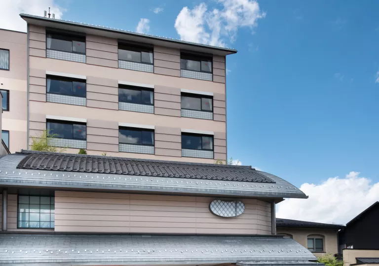 Exterior view of multi-story beige building