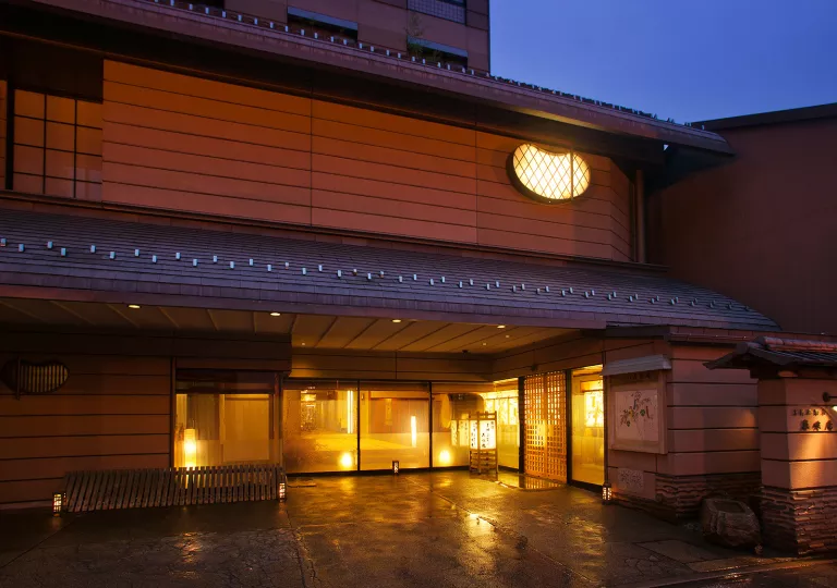 Exterior view of japanese hotel building in the evening