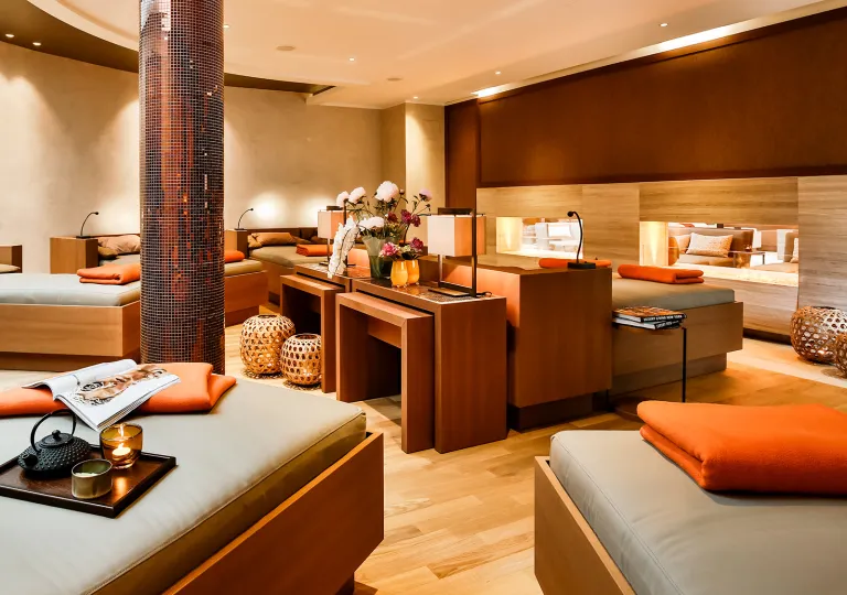 Hotel spa room with massage beds in a circular formation