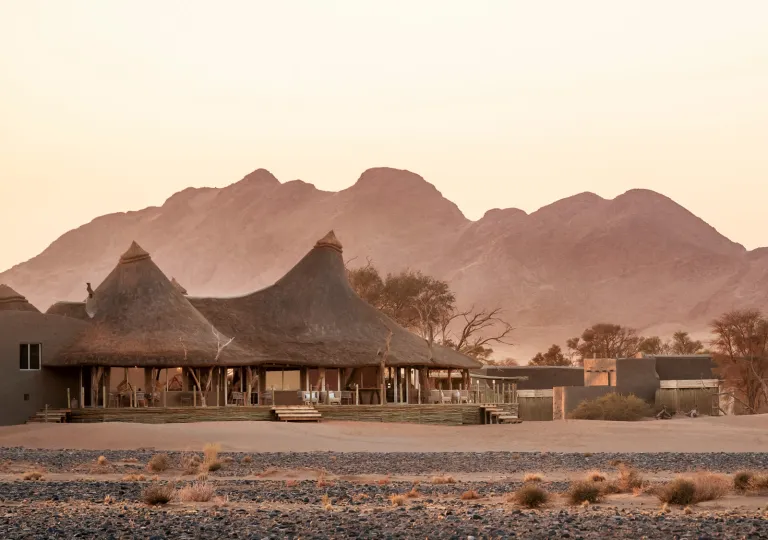 Large huts in the middle of a desert