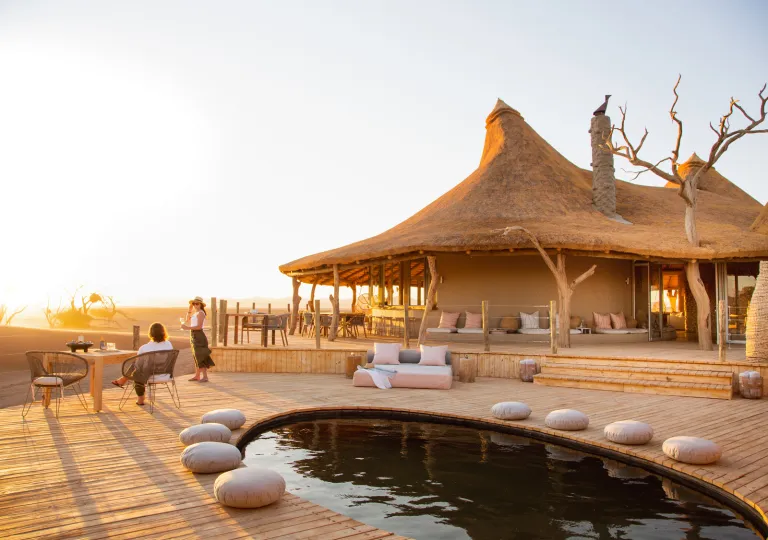 Large hut with an outdoor pool in front