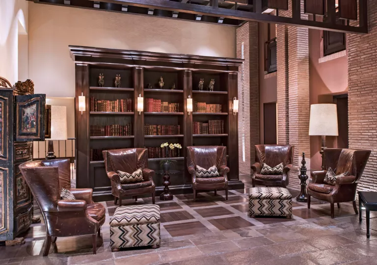 Library and seating area with 4 large leather chairs