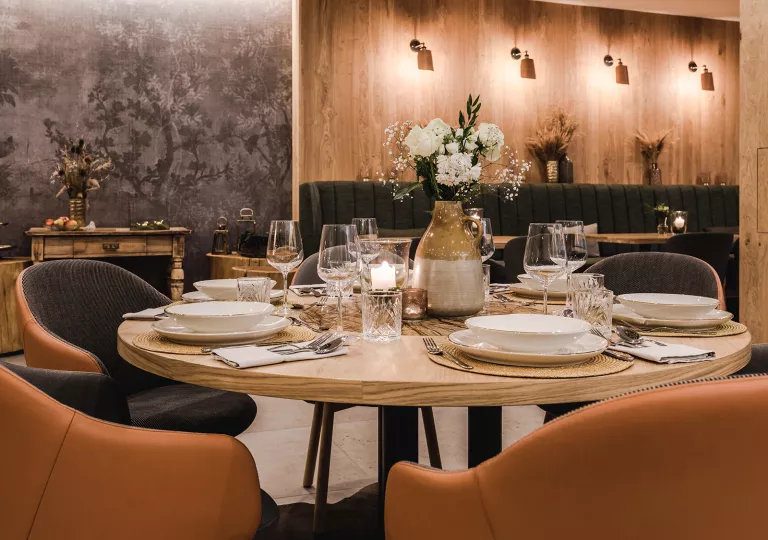 Restaurant with dining table and brown chairs