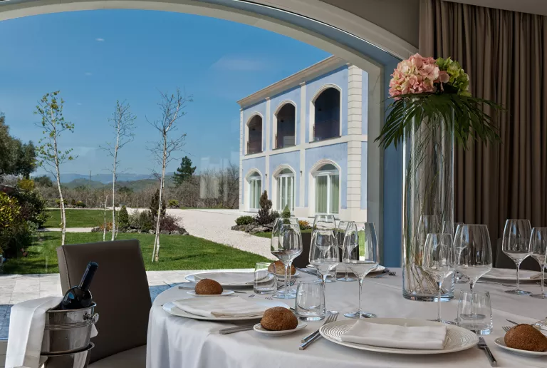 A table is set on a patio at Villa Neri