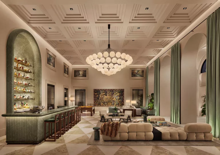 Hotel lobby with large chandelier and couches around the room