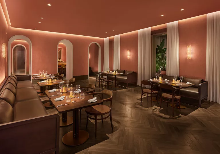 Bar and lounge with cushioned, leather sofas and small tables