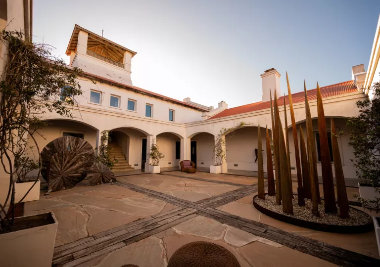 Outdoor courtyard with a large building in the back