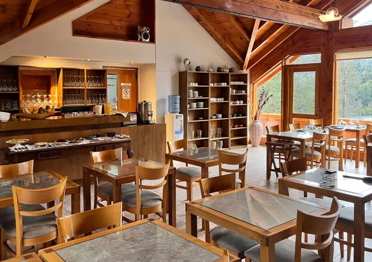 Restaurant with square dining tables and wooden chairs