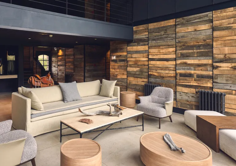 Lounge with beige soda and gray chairs