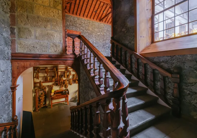 Staircase in a building, with stone walls