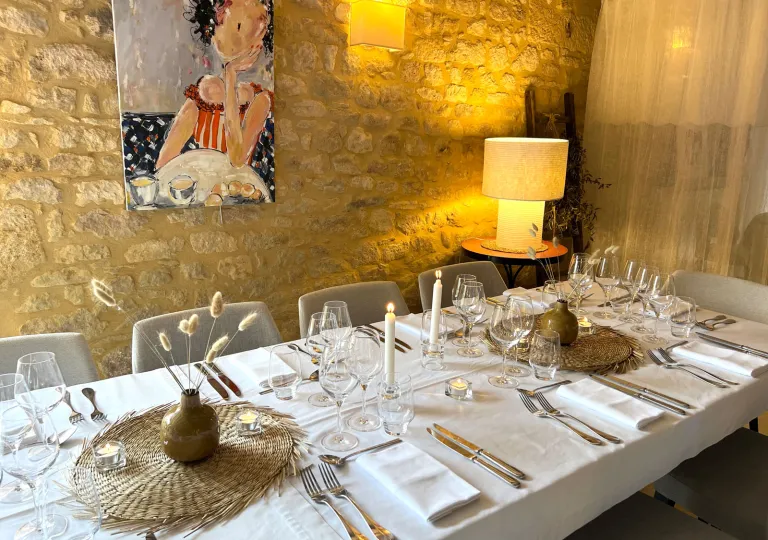 Restaurant dining table with a long white tables and wine glasses