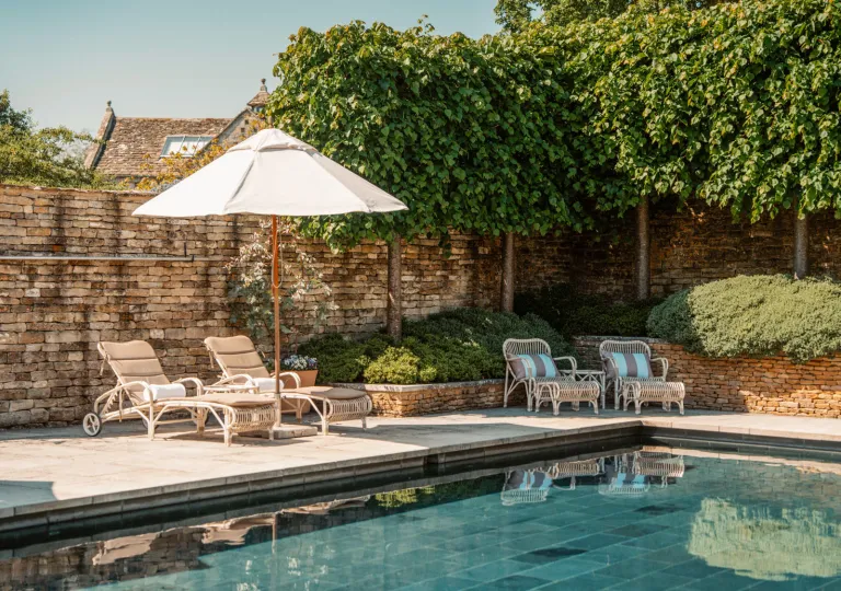 The outdoor swimming pool at Thyme hotel located in Southrop, Gloucestershire, in the Cotswolds, UK.