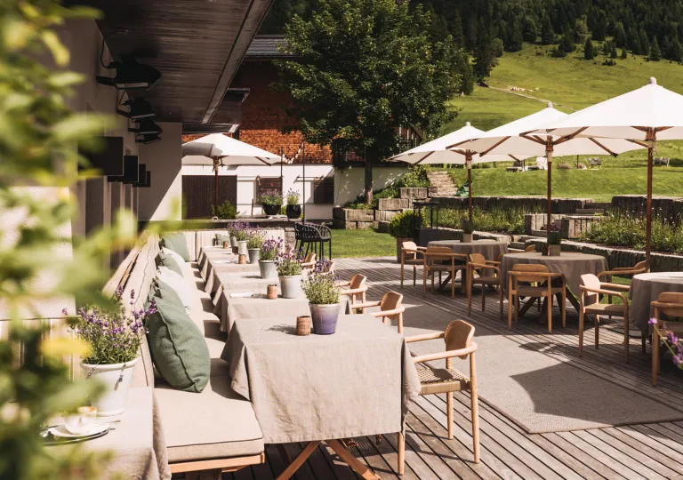 Outdoor patio with dining tables and white umbrellas