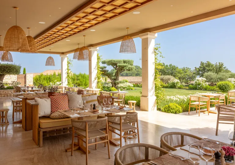 The outdoor terrace of the Casa Gia restaurant located at the La Bastide Saint Georges hotel in Forcalquier.